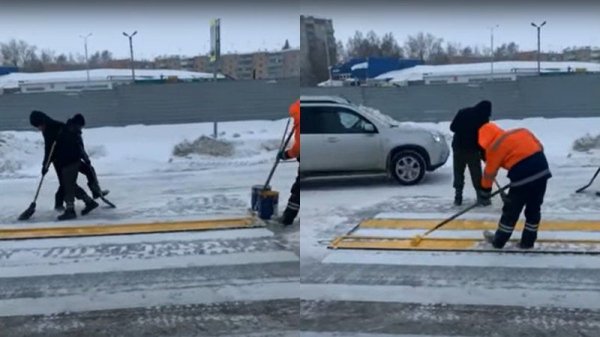 «Подарок от подрядчика»:бердские рабочие рисуют дорожную разметку в метель «Подарок от подрядчика»:бердские рабочие рисуют дорожную разметку в метель